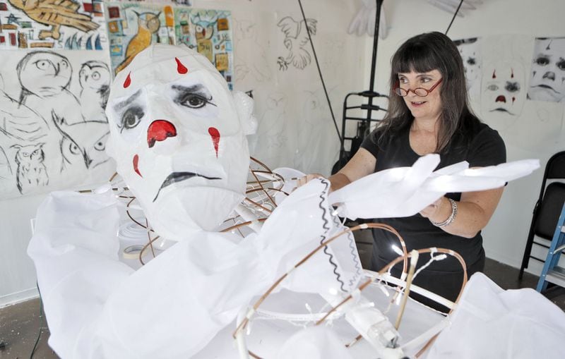 Chantelle Rytter works on one of her super-sized street puppets. This one is a replica of Puddles Pity Party, the singing clown, in her midtown studio. PHOTO: BOB ANDRES /BANDRES@AJC.COM