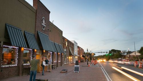 Downtown Alpharetta has worked to create a destination district of restaurants, shops and services that has drawn developers ready to build homes for buyers who want to be close by. Contributed by JASON GETZ/FILE