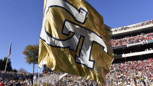 November 26, 2016, Athens - Georgia Tech's flag is waved after the conclusion of the NCAA college football game between the University of Georgia and Georgia Tech in Athens, Georgia, on Saturday, November 26, 2016. Tech beat UGA 28-27. (DAVID BARNES / DAVID.BARNES@AJC.COM)