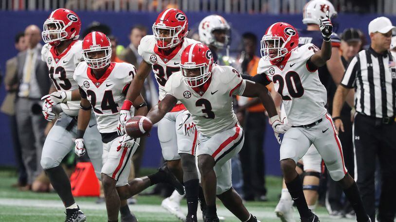 Georgia Bulldogs linebacker Roquan Smith (3) leads the defense in a celebration after recovering a fumble at Mercedes-Benz Stadium, December 2, 2017, in Atlanta.