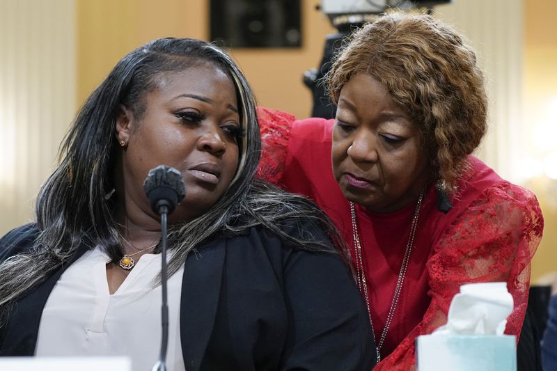 Wandrea "Shaye" Moss, a former Georgia election worker, is comforted by her mother, Ruby Freeman, right, during congressional testimony last year. The pair endured harassment and death threats after Rudy Giuliani accused them of participating in election fraud, and Freeman fled her home for months on the advice of the FBI. (AP Photo/Jacquelyn Martin, File)