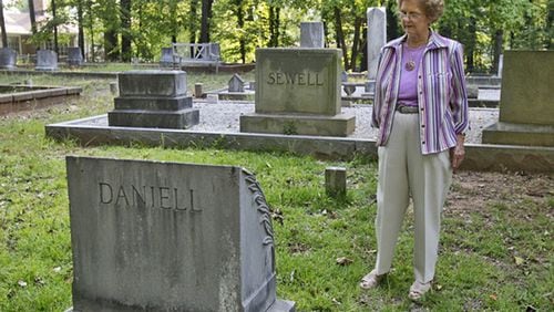 The Daniell Cemetery now is owned by the city of Smyrna. This 2012 picture shows Lillie Wood, giving a tour. AJC file photo