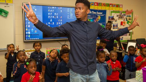 Georgia Pre-K Teacher of the Year, Johnathon Hines , works with his students at Barack H. Obama Elementary Magnet School of Technology in Atlanta on Tuesday, Oct. 15, 2019. His Teacher of the Year honor showed his pivot from a lifelong dream of playing professional basketball to a goal of showing little black boys and girls that black people can be successful outside of sports and entertainment. He’s also the first black man in the state to receive the honor. PHOTO BY PHIL SKINNER