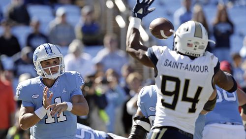 North Carolina quarterback Nathan Elliott (11) has a pass blocked by Georgia Tech's Anree Saint-Amour (94) during the first half of an NCAA college football game in Chapel Hill, N.C., Saturday, Nov. 3, 2018. (AP Photo/Gerry Broome)