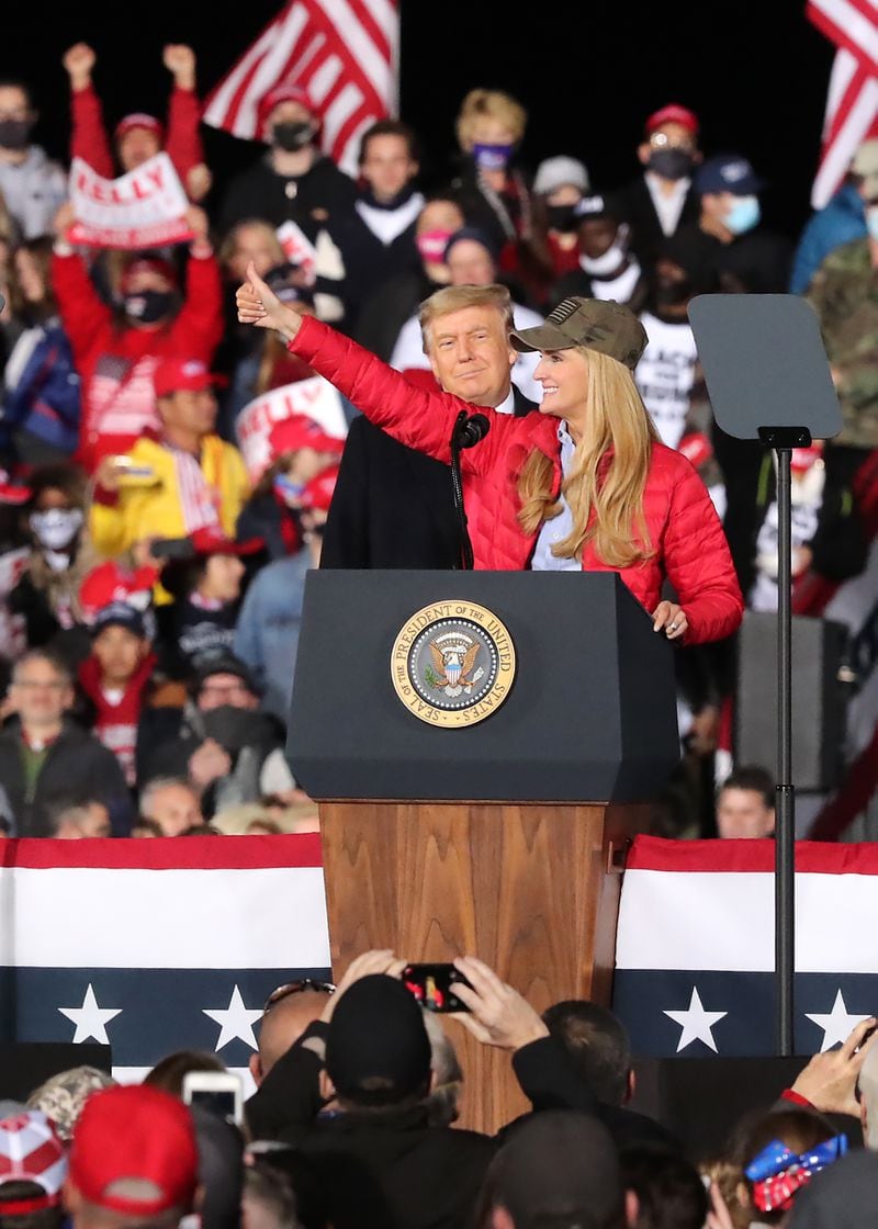 Senator Kelly Loeffler speaks to supporters while President Donald J. Trump looks on at the Republican National Committee's Victory Rally at the Dalton Regional Airport on Monday, Jan. 4, 2021, in Dalton.   (Curtis Compton / Curtis.Compton@ajc.com)