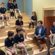 Cornerstone Academy Headmaster Colin Creel (second from right) reads to a class of students the library. For the Top Workplace small sized business. PHIL SKINNER FOR THE ATLANTA JOURNAL-CONSTITUTION