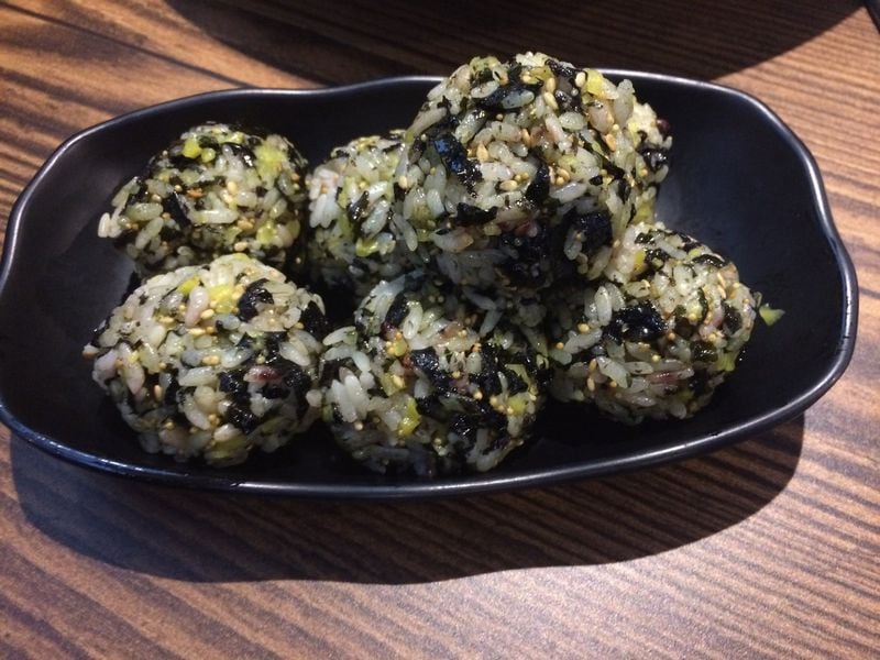 At Jok Ga A Dong Chim in Duluth, rice balls are rolled and shaped tableside by a server; they are a delicious way to start the meal and a nice foil to chile-peppered Korean cuisine. CONTRIBUTED BY WENDELL BROCK