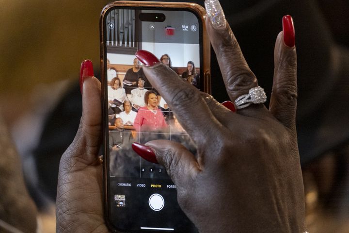 A woman photographs the Rev. Dr. Bernice King  during the Dr. Martin Luther King Jr. Day program at Ebenezer Baptist Church in Atlanta on Monday, Jan. 15, 2024.   (Ben Gray / Ben@BenGray.com)