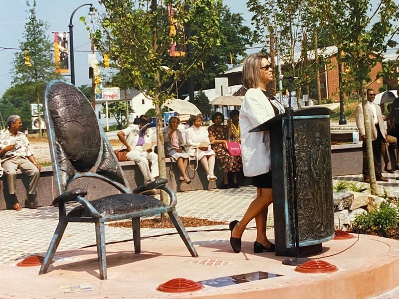 Atlanta-born artist Emma Amos designed the memorial to Rev. Ralph Abernathy for the 1996 Olympics. Her piece "We Will Not Forget" was one of several public art projects commissioned for the games in Atlanta. She worked with the family and included their input in the design. Here she speaks at the dedication. The piece still stands in Abernathy Plaza in Mechanicsville.