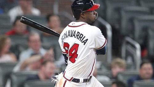 Atlanta Braves' Adeiny Hechavarria hits a double against the Miami Marlins during the ninth inning of a baseball game Thursday, Aug. 22, 2019, in Atlanta. (AP Photo/Tami Chappell)