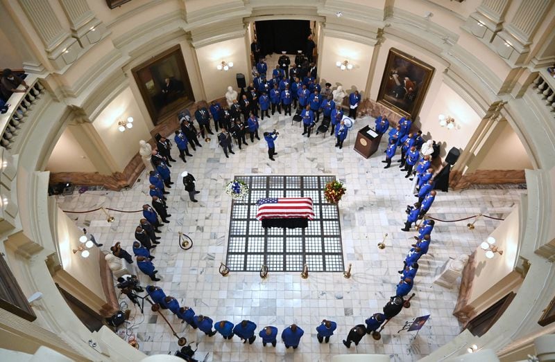 July 29, 2020 Atlanta - The flag-draped casket of Congressman John Lewis is surrounded by Phi Beta Sigma fraternity members during Omega Chapter Ceremony at the Georgia State Capitol in Atlanta on Wednesday, July 29, 2020. (Hyosub Shin / Hyosub.Shin@ajc.com)