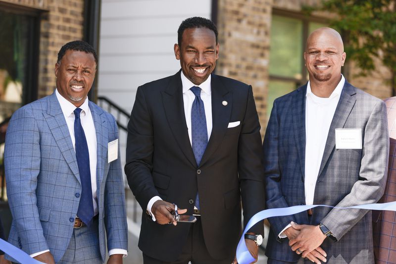 Mayor Andre Dickens (middle) with Atlanta Beltline CEO Clyde Higgs (left) and Edrick Harris of Prestwick Development (right) at the ribbon cutting ceremony for the opening of Parkside, a new affordable housing community. (Natrice Miller / natrice.miller@ajc.com)

