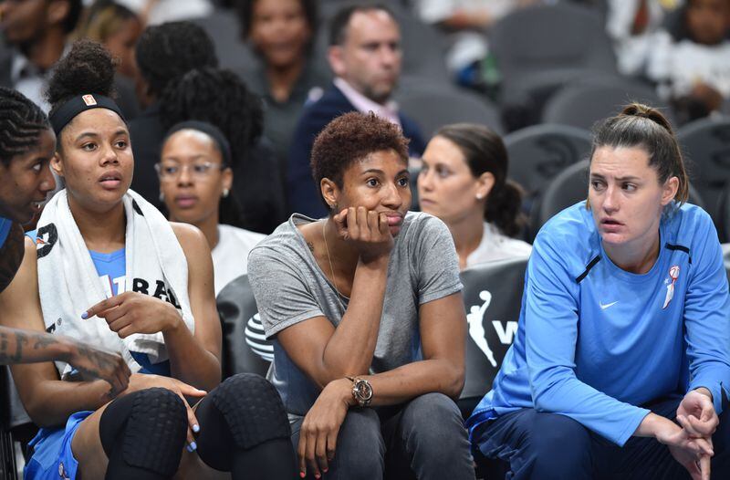June 19, 2019 Atlanta - Atlanta Dream forward Angel McCoughtry (center) watches with teammates during the first half of WNBA basketball game at State Farm Arena in Atlanta on Wednesday, June 19, 2019. Atlanta Dream won 88-78 over the Indiana Fever. HYOSUB SHIN / HSHIN@AJC.COM