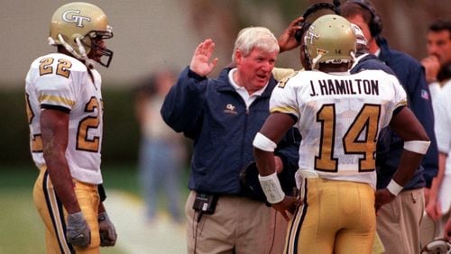 Georgia Tech coach George O'Leary talks with quarterback Joe Hamilton and wide receiver Dez White in the third quarter of the game between Georgia Tech and North Carolina at Bobby Dodd Stadium on Saturday, October 9, 1999. (LEVETTE BAGWELL/AJC File)