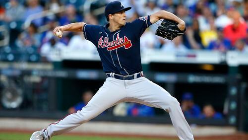 Braves starting pitcher Kyle Wright (30) throws against the New York Mets during the first inning of a baseball game Wednesday, June 23, 2021, in New York.