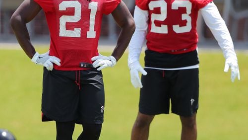 June 13, 2017, Flowery Branch: Atlanta Falcons cornerbacks Demond Trufant and Robert Alford take the field for the first day of mini-camp on Tuesday, June 13, 2017, in Flowery Branch.     Curtis Compton/ccompton@ajc.com