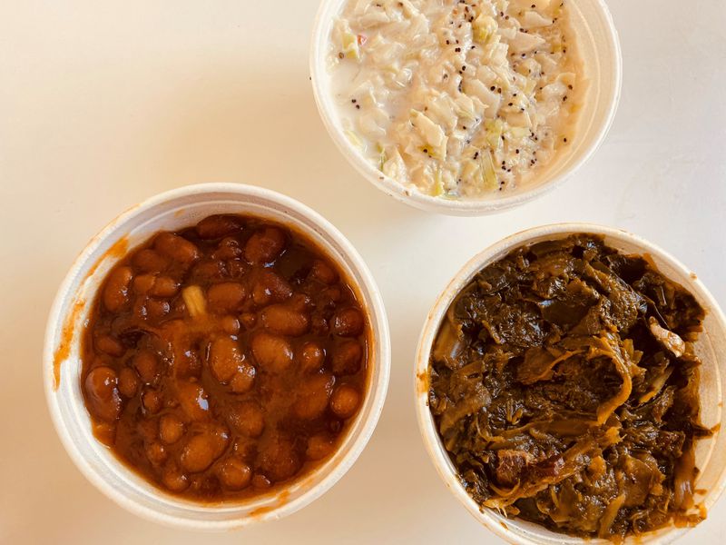 Sides at Dave Poe’s BBQ include baked beans, coleslaw and collard greens. Bob Townsend for The Atlanta Journal-Constitution 

