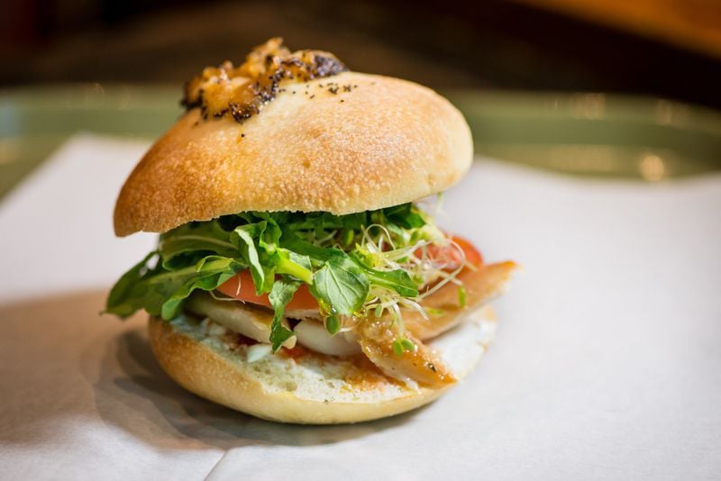  Bialy and Smoked Trout sandwich from TGM Bagel with creme fraiche, arugula, tomato, fermented peppers, sprouts, and avacado. Photo credit- Mia Yakel.