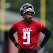 Michael Penix Jr. takes a break while participating in Falcons' rookie minicamp Friday May 10, 2024, in Flowery Branch, Ga. (Jason Getz / AJC)
