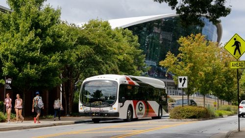 The University of Georgia campus is divided between two state House districts along Carlton Street where Stegeman Coliseum is located.  The Coliseum is in one district where the bus stops, while across the street has a different representative. Wednesday, Sept 1, 2021.  (Jenni Girtman for The Atlanta Journal-Constitution)