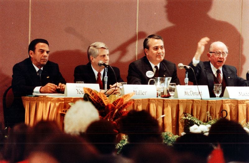 During the 1990 campaign for governor, Andy Young. far left, criticized fellow Democrat Zell Miller, second from left, for his investment in a North Georgia bank. Young said the banking stock created a conflict of interest for Miller, who would be called on to sign banking legislation. Miller responded by placing his assets in a blind trust. (Frank Niemeir / AJC file)