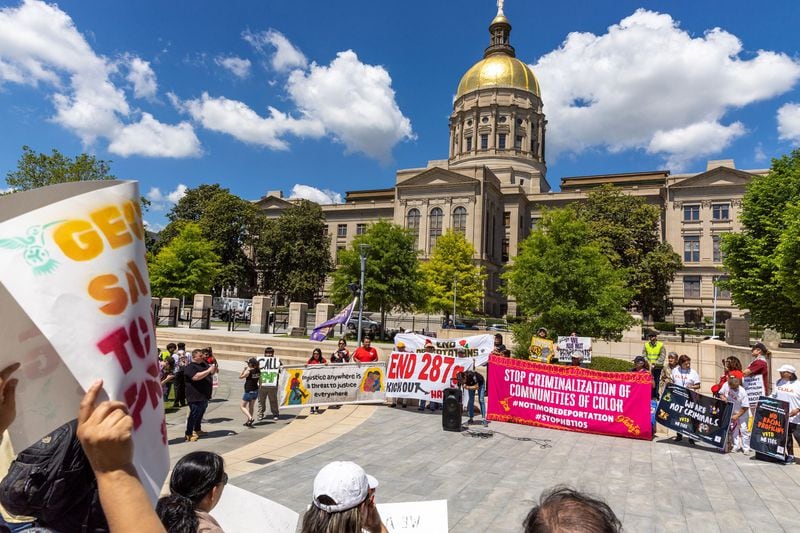 Immigrant rights activists protest HB 1105, which would would mandate that local law enforcement work more closely with ICE, at Liberty Plaza in front of the Capitol in Atlanta on Wednesday, May 1, 2024. (Arvin Temkar/The Atlanta Journal-Constitution/TNS)