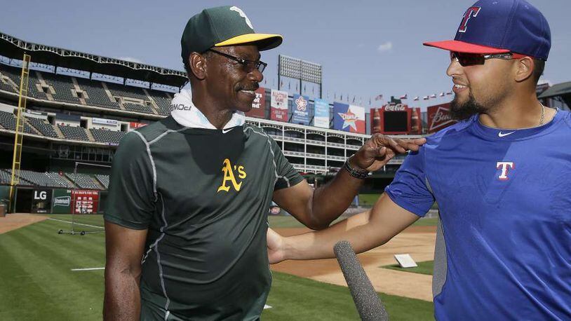 New Braves third-base coach Ron Washington was an Oakland coach when he was greeted warmly by Rougned Odor of the Texas Rangers, the team Washington previously managed. (AP file photo)
