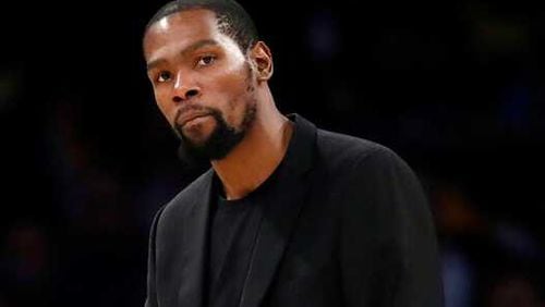 Brooklyn Nets' Kevin Durant looks on during the second half of an NBA basketball game against the Los Angeles Lakers Tuesday, March 10, 2020, in Los Angeles. (AP Photo/Marcio Jose Sanchez)
