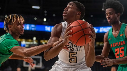 Georgia Tech forward Moses Wright (5) looks to pass the ball against Florida A&M during the first half of an NCAA college basketball game in Atlanta, Friday, Dec. 18, 2020. (Alyssa Pointer/Atlanta Journal-Constitution via AP)