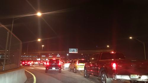 The line of Uber and Lyft drivers at 11:36 p.m. Thursday waiting to enter Hartsfield-Jackson’s economy lot to pick up passengers. Credit: Kelly Yamanouchi