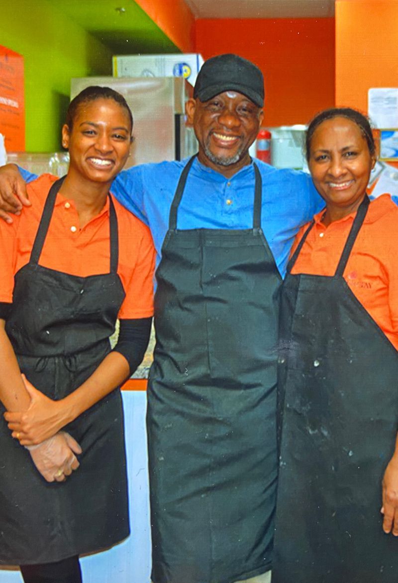 Kennesaw’s Jojo Fritay is a family affair: Francois Nau runs the 3-year-old Haitian restaurant with his daughter Jo (left) and his wife, Edith. Courtesy of Jojo Fritay