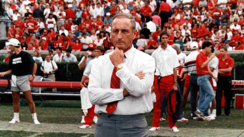 Vince Dooley of UGA stands on his home turf of Sanford Stadium and eyes the pre-drill of his Bulldogs before Tennessee.