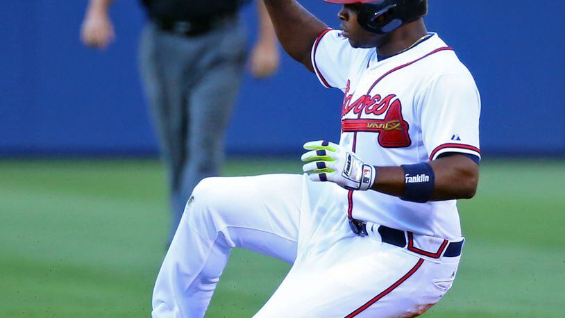 Justin Upton beats the throw to second for a double against the Cardinals during the first inning of a MLB game on Wednesday, May 7, 2014, in Atlanta. CURTIS COMPTON / CCOMPTON@AJC.COM