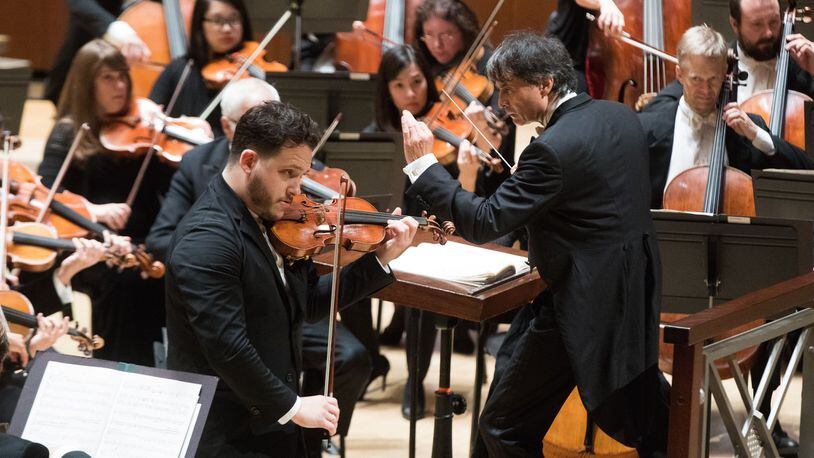 Guest conductor Jun Markl leads the Atlanta Symphony Orchestra and Giora Schmidt in the Vieuxtemps Violin Concerto No. 5. CONTRIBUTED BY JEFF ROFFMAN