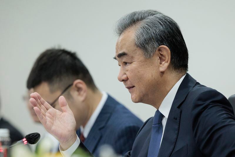 Chinese Foreign Minister Wang Yi gestures as he speaks during his bilateral meeting with Indonesian Foreign Minister Retno Marsudi in Jakarta, Indonesia, Thursday, April 18, 2024. (Yasuyoshi Chiba/Pool Photo via AP)