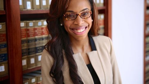 Marriah N. Paige, 27, shown in the law library at the University of Tennessee, had to recalculate her route after the results of her first bar exam left her heartbroken. CONTRIBUTED BY PATRICK MORRISON