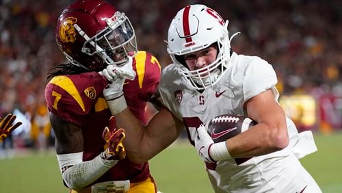 Southern California safety Calen Bullock (7) defends against Stanford tight end Benjamin Yurosek (84) during the second half of an NCAA college football game in Los Angeles, Saturday, Sept. 9, 2023. (AP Photo/Ashley Landis)