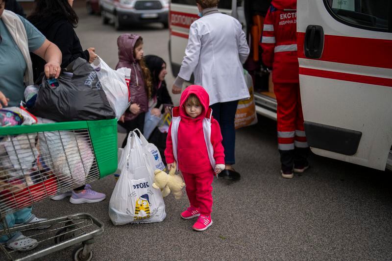 Patients are evacuated from Children's Hospital No. 1 on the outskirts of Kyiv, Ukraine, Friday, April 26, 2024. Doctors and ambulance crews evacuated patients from a Kyiv children's hospital on Friday after a video circulated online saying Russia planned to attack it. (AP Photo/Francisco Seco)