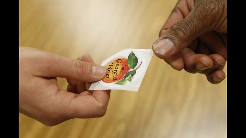 <p>
              A poll worker hands a voter a, "I'm a Georgia voter," sticker after casting her ballot in Georgia's primary election at Chase Street Elementary in Athens, Ga., Tuesday, May 22, 2018. (Joshua L. Jones/Athens Banner-Herald via AP)
            </p> <p>
              Voters cast their ballots at Chase Street Elementary for Georgia's primary election in Athens, Ga., Tuesday, May 22, 2018. (Joshua L. Jones/Athens Banner-Herald via AP)
            </p> <p>
              Voters cast their ballots in the state's primary election at Clarke Central High School in Athens, Ga., Tuesday, May 22, 2018. (Joshua L. Jones/Athens Banner-Herald via AP)
            </p> <p>
              Voters cast their ballots at Clarke Central High School for Georgia's primary election in Athens, Ga., Tuesday, May 22, 2018. (Joshua L. Jones/Athens Banner-Herald via AP)
            </p> <p>
              REMOVES REFERENCE TO CHASE ELEMENTARY Voters cast their ballots at Clarke Central High School for Georgia's primary election in Athens, Ga., Tuesday, May 22, 2018. (Joshua L. Jones/Athens Banner-Herald via AP)
            </p>