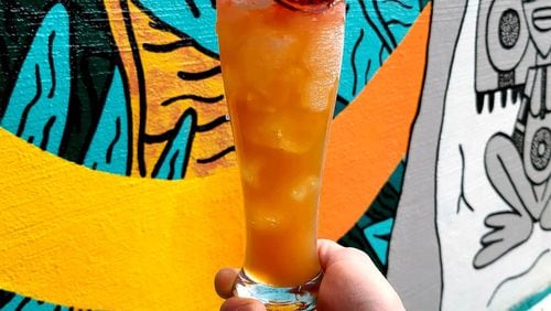 Economists say they expect restaurants and entertainment to be among the hiring leaders as consumer demand surges over the next few months. Here, to-go cocktail called the Airline Hurricane at the Beltline's Cold Beer. 
Courtesy of Cold Beer