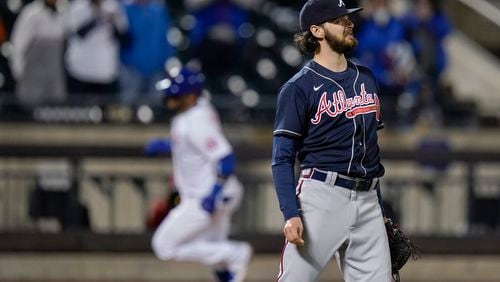 Atlanta Braves' Ian Anderson reacts as New York Mets' Jonathan Villar runs the bases on a home run during the fifth inning of a baseball game Saturday, May 29, 2021, in New York. (AP Photo/Frank Franklin II)