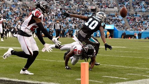 Falcons’ Desmond Trufant (21) breaks up a pass to Carolina’s Curtis Samuel in the fourth quarter Sunday, Dec. 23, 2018, at Bank of America Stadium in Charlotte, N.C.