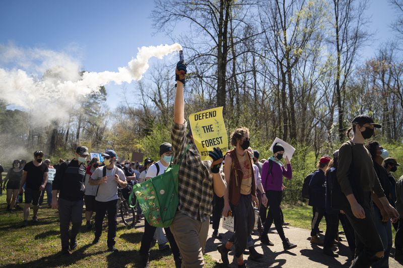 People protest Atlanta’s plan to build a police and fire training center known to critics as “Cop City,” in Gresham Park near Atlanta, March 4, 2023. Atlanta is ready to build the complex, but opponents say that it will further militarize officers and destroy precious green space. (Nicole Craine/The New York Times)