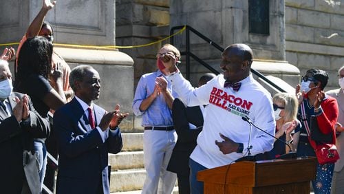 Mawhli Davis, Co-Chair of Beacon Hill Black Alliance for Human Rights, spoke about the removal of an obelisk Confederate monument on the courthouse grounds in June. JOHN AMIS FOR THE ATLANTA JOURNAL-CONSTITUTION