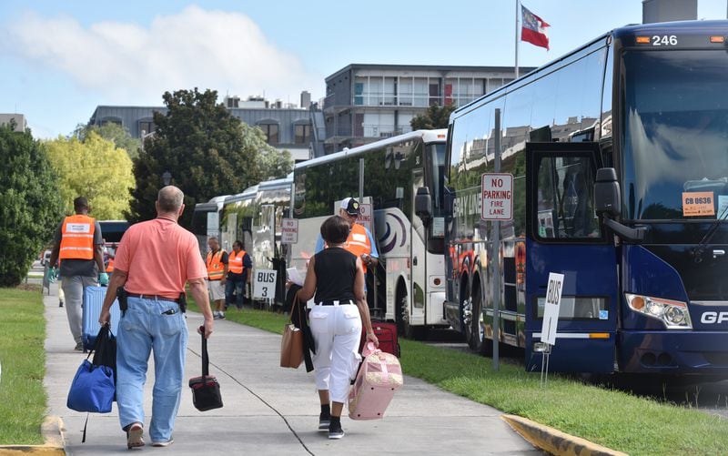 September 3, 2019 Savannah - Hundreds of local residents get on buses outside the Savannah Civic Center for a free transportation to an inland shelter under mandatory evacuation ahead of Hurricane Dorian on Tuesday, September 3, 2019. Chatham Area Transit (CAT) provided free transportation to residents without private transportation to the Savannah Civic Center to assist in the mandatory evacuation of Chatham County. (Hyosub Shin / Hyosub.Shin@ajc.com)