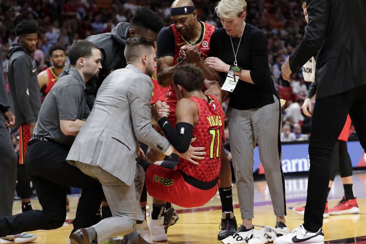 Photos: Hawks star Trae Young injures ankle