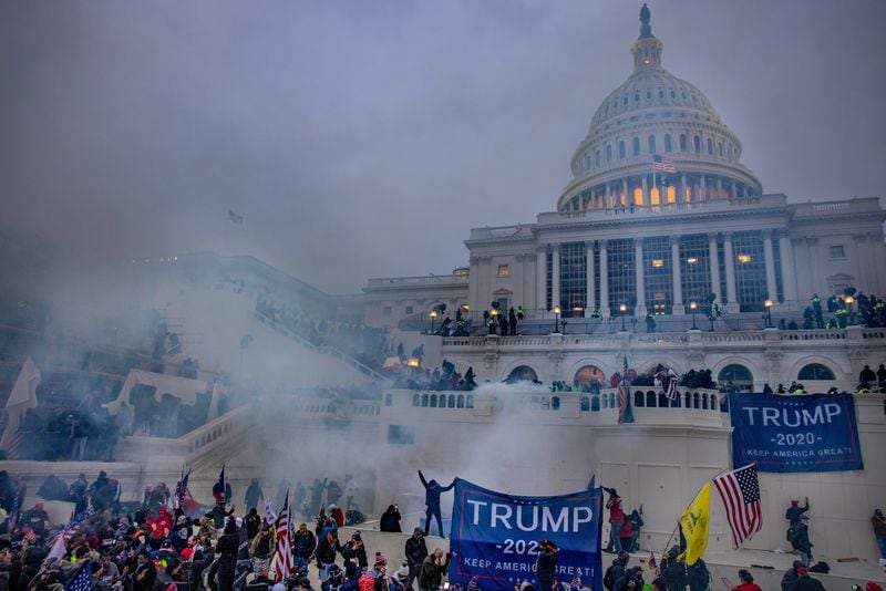 Tear gas is fired at supporters of President Donald Trump who stormed the U.S. Capitol on Jan. 6, 2021. (Evelyn Hockstein for The Washington Post) 