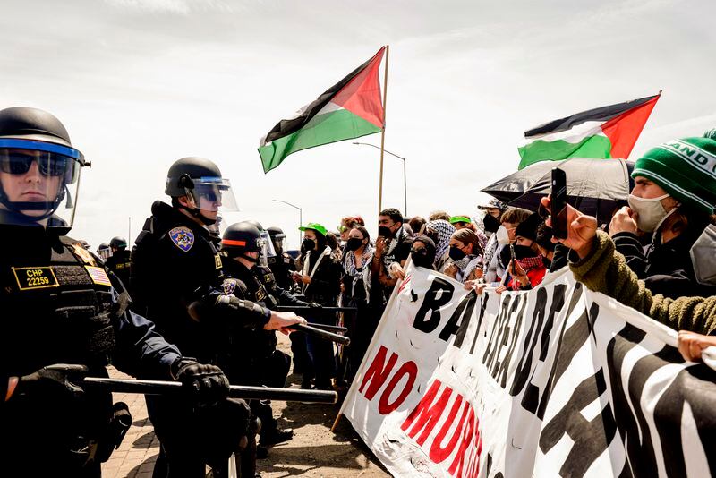 Demonstrators protesting the ongoing war in Gaza, block southbound traffic on Interstate 880 in Oakland, Calif., on Monday.