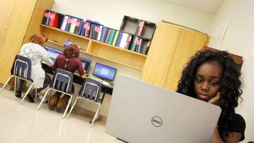 A partnership launching this school year between Atlanta Public Schools and Sprint will place electronic devices in the hands of 1,500 high schoolers, who will be able to access the internet at home and not just on school computers. TAYLOR CARPENTER / TAYLOR.CARPENTER@AJC.COM