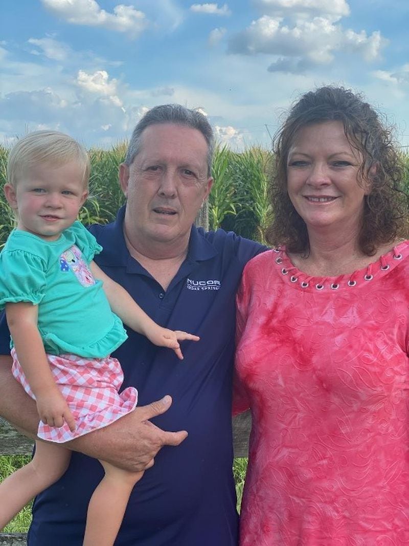 Brian Kelley has been hospitalized for weeks with COVID-19 and will need weeks if not months more of health care to recover, said his wife, Sherrie. The family, shown here with a grandchild, lives in Colquitt, Georgia. CONTRIBUTED